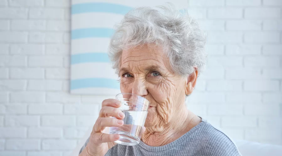 Senior Citizen drinking water