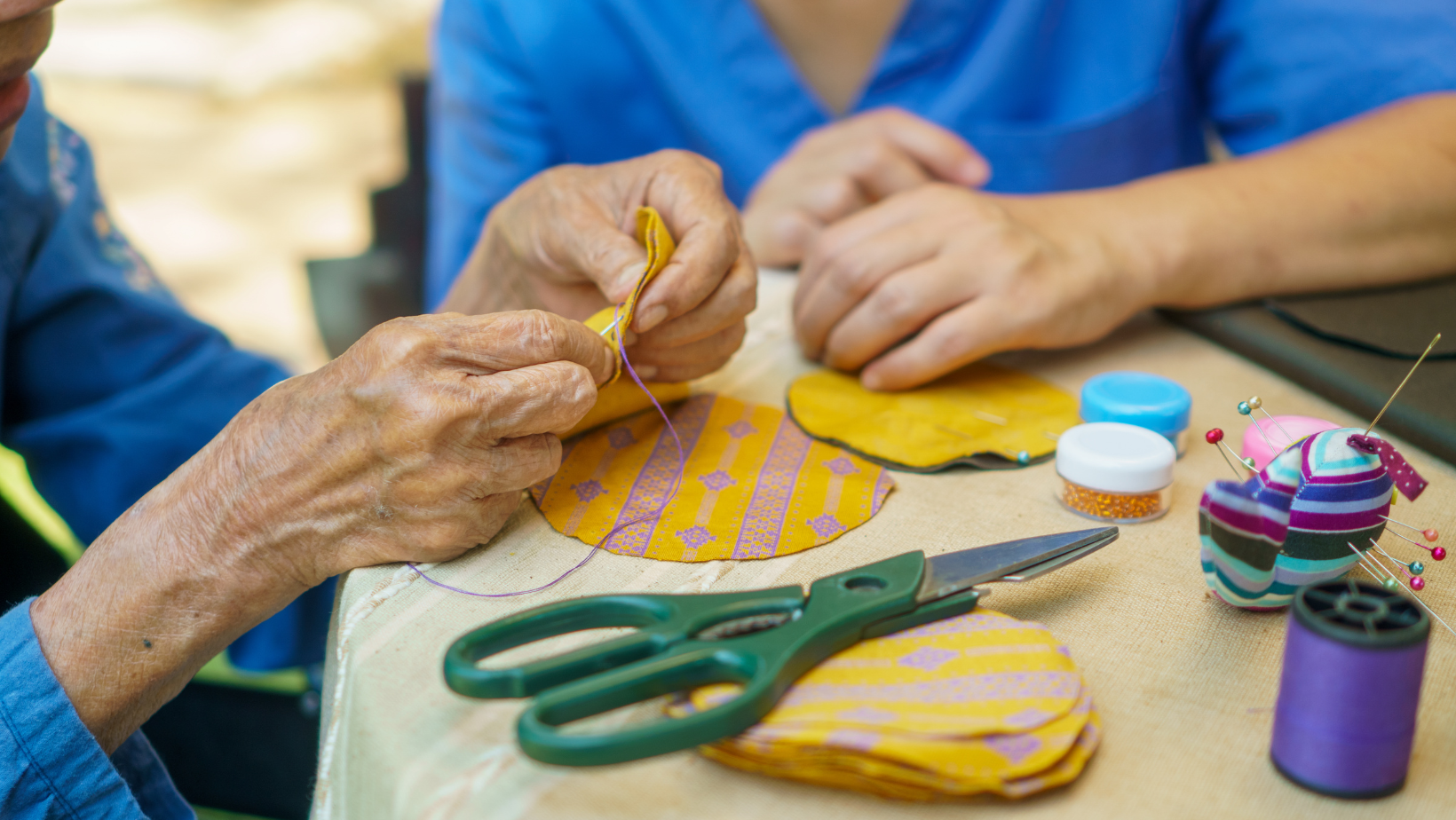elderly woman doing crafts